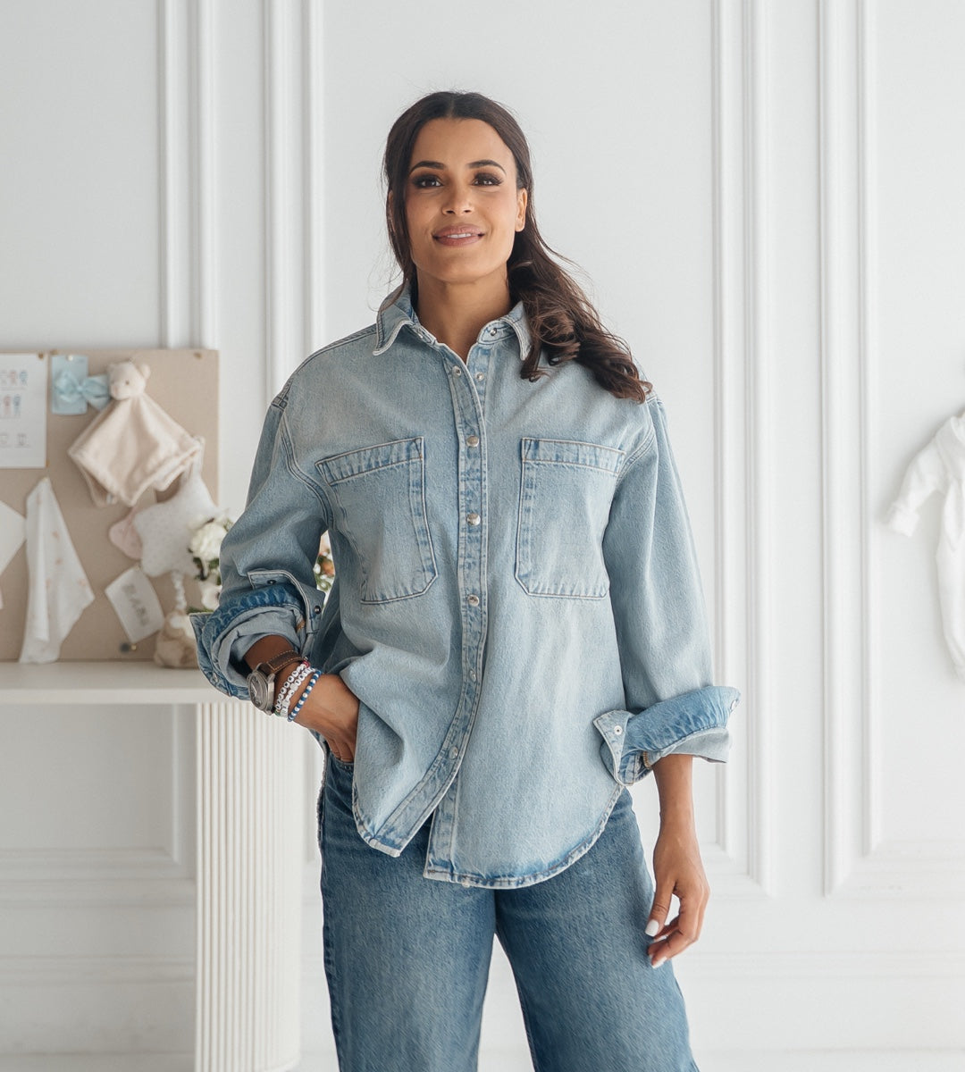 Mother in baby clothing studio