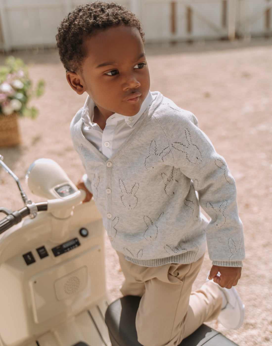 Baby boy in knitted cardigan